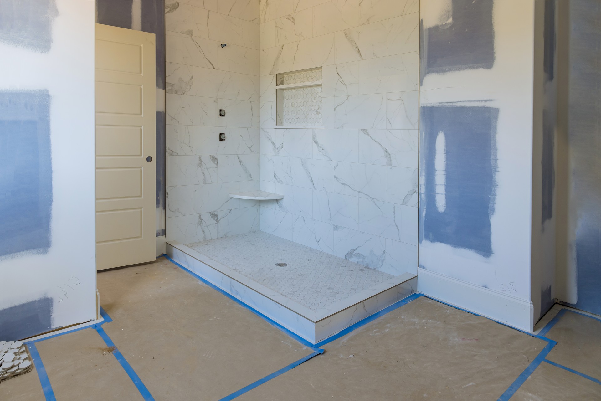  construction of master bathroom with new under construction bathroom interior drywall ready for tile